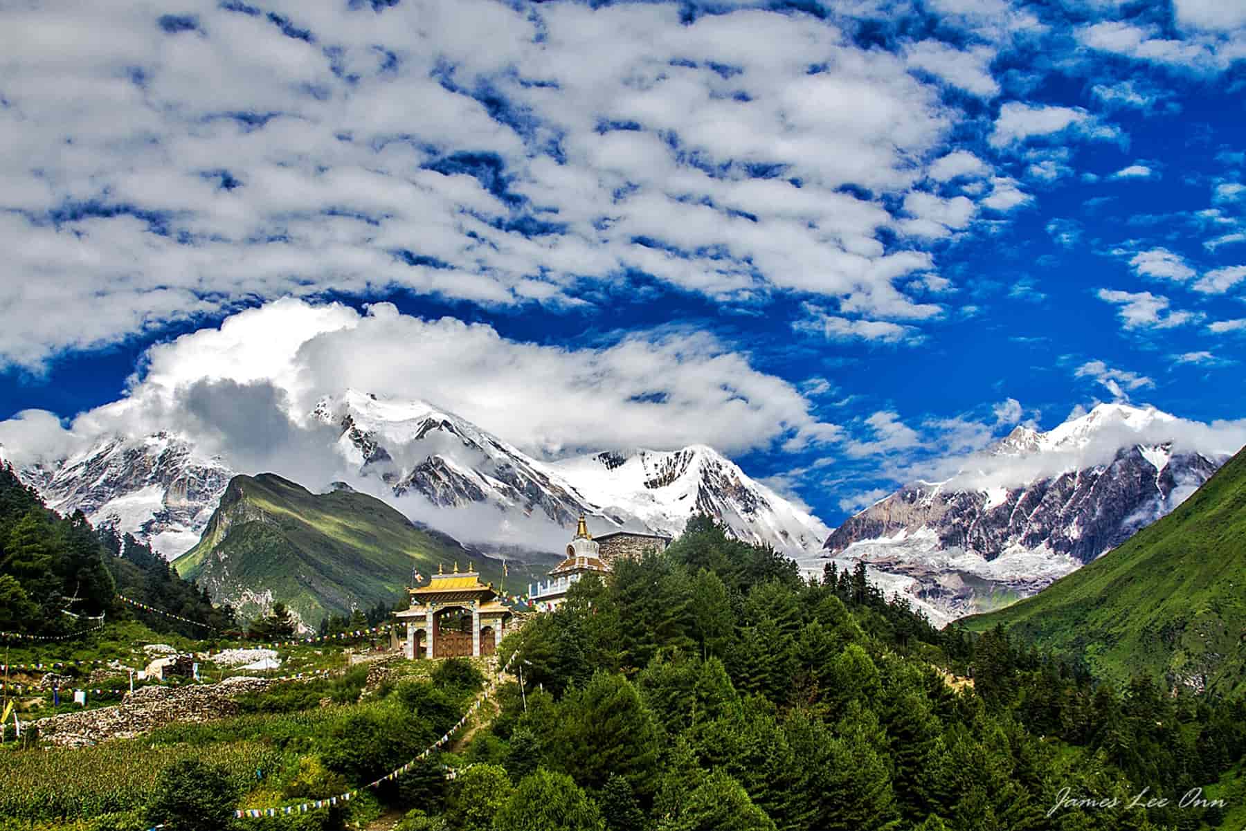 Serene Landscape of Tsum Valley with Rolling Hills and Majestic Mountains